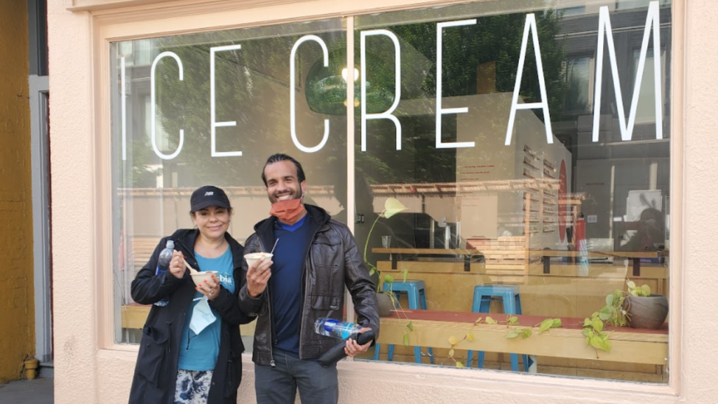 A smiling couple enjoying ice cream during a Portland by Mouth food tour.