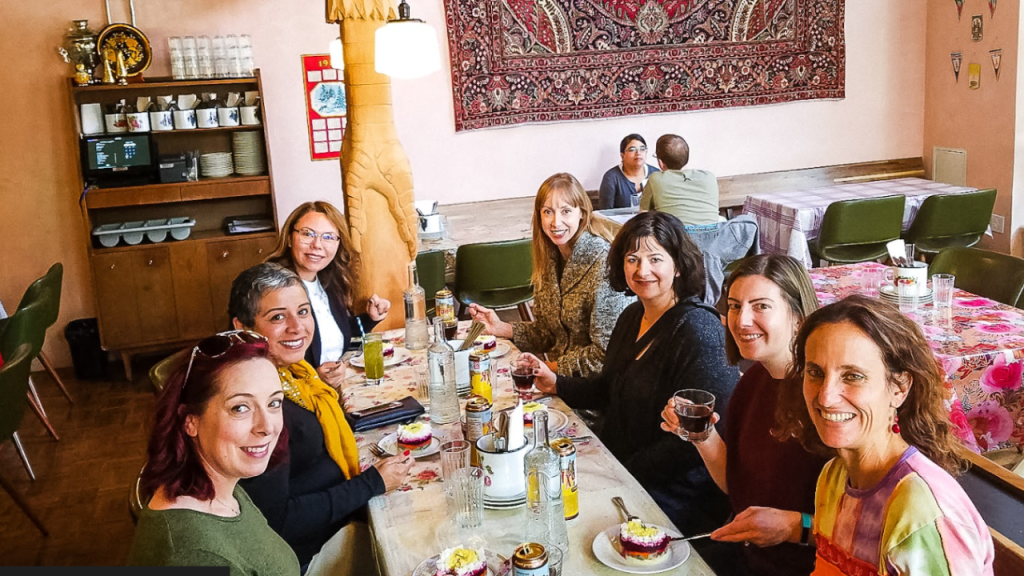 Guests enjoying drinks and desserts during a Portland by Mouth food tour.