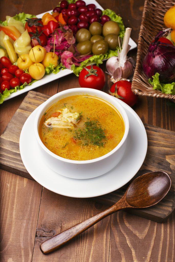 Chicket soup with a piece of meat.