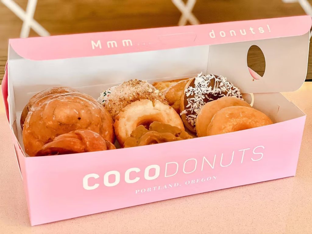 A box filled with donuts from Coco Donuts